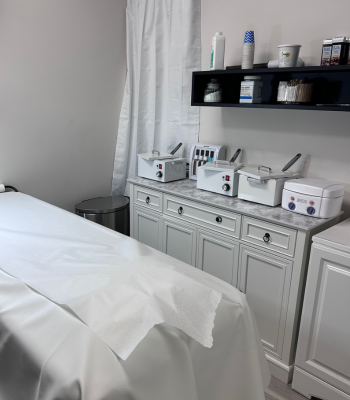 Clean and modern waxing treatment room with professional setup